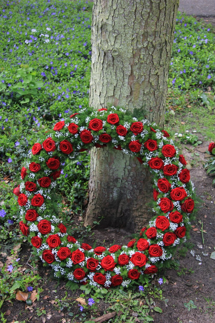 Funeral wreath near a tree